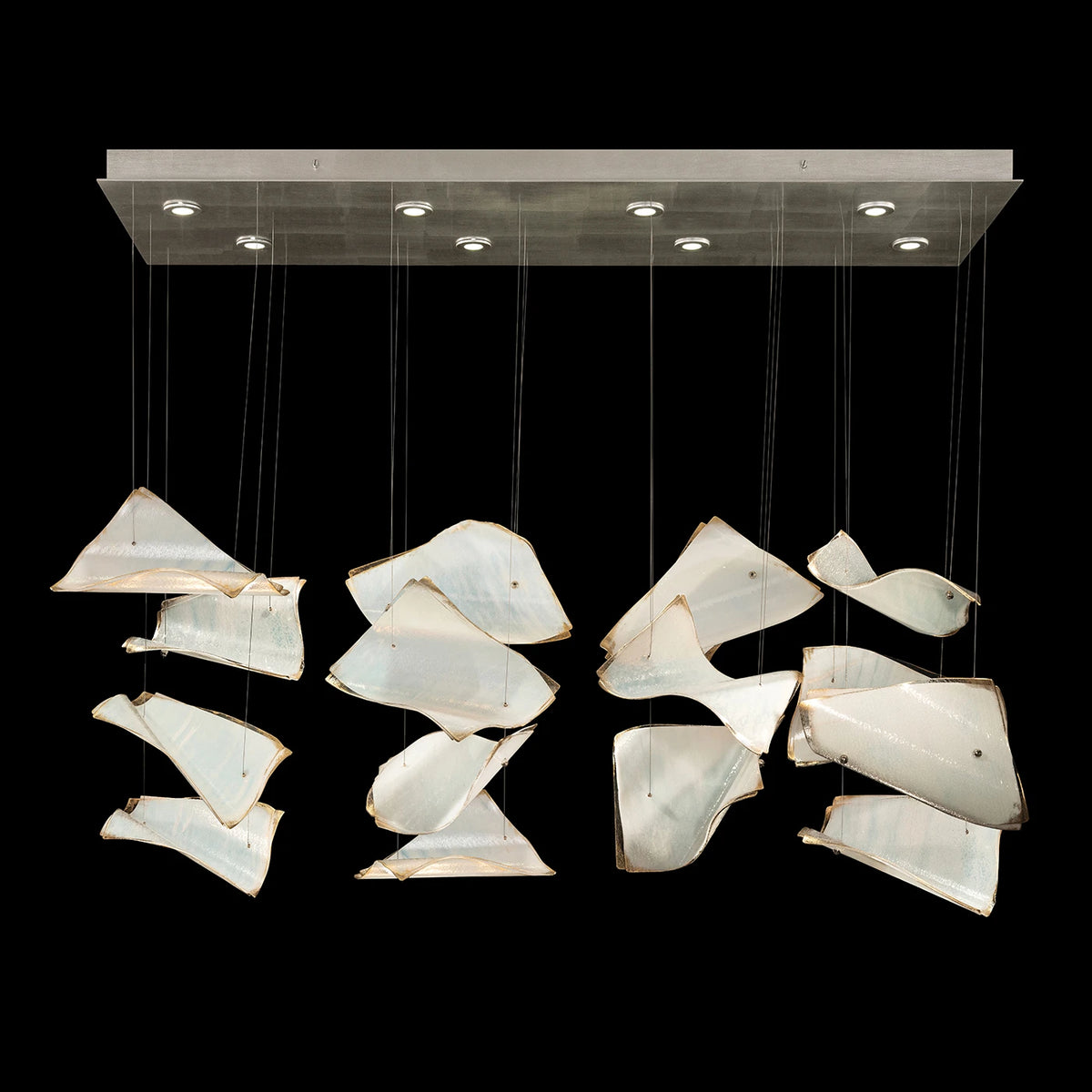 Linear chandelier with curved ivory glass panels suspended beneath a rectangular silver canopy.