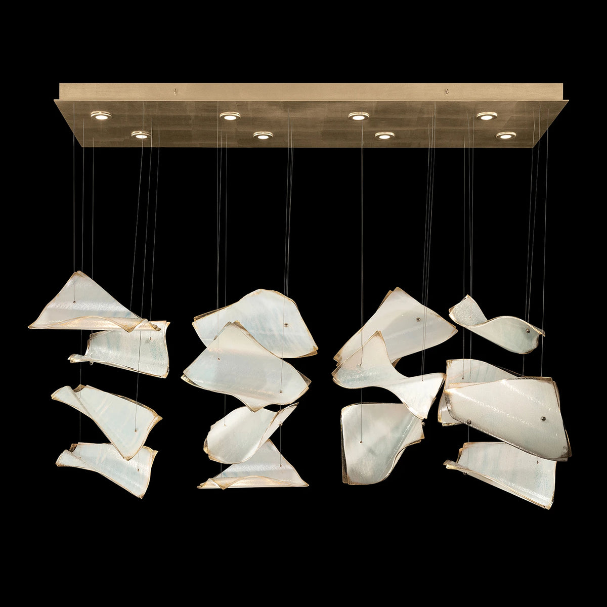 Linear chandelier with curved ivory glass panels suspended beneath a rectangular gold-toned canopy.
