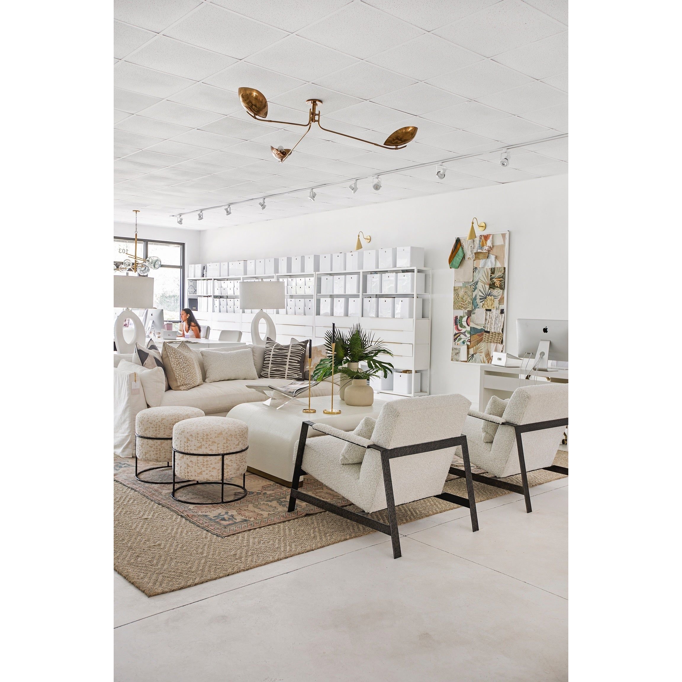 Avondale antique brass ceiling light in bright open-plan studio interior, wide-angle view with modern seating area
