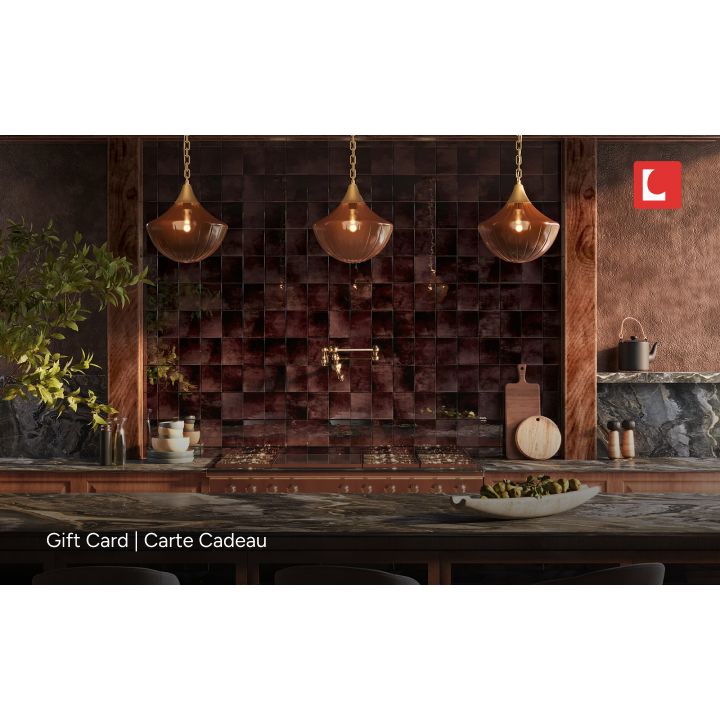 Modern kitchen with wooden cabinets, pendant lights, and a decorative wall.