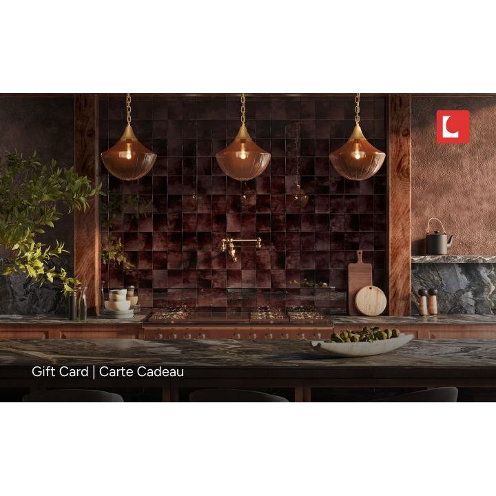 Modern kitchen with wooden cabinets, pendant lights, and a decorative wall.