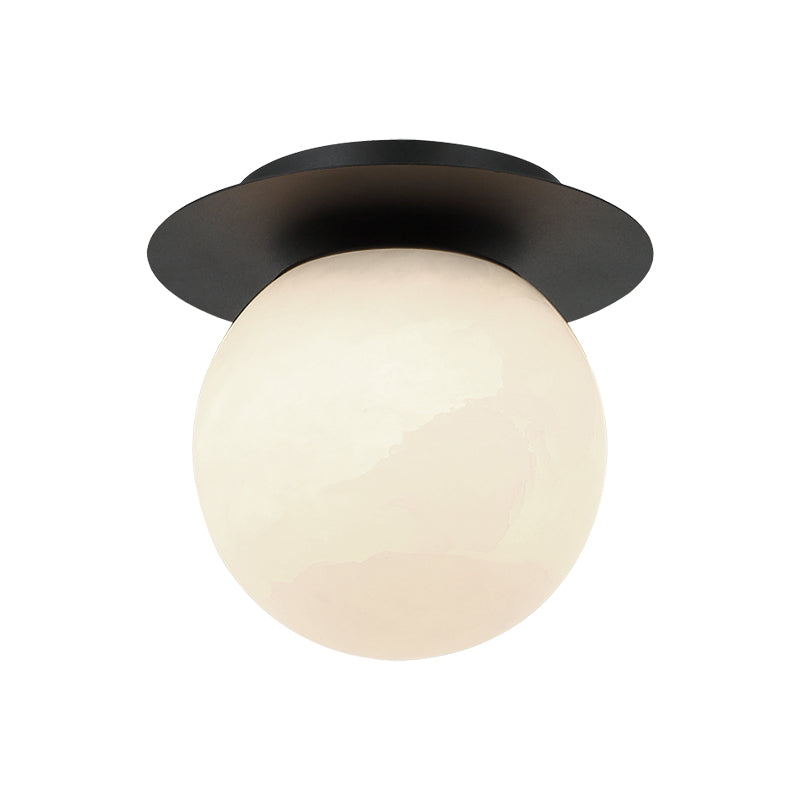Flush mount ceiling light with matte black disc canopy and large frosted globe shade, product photo