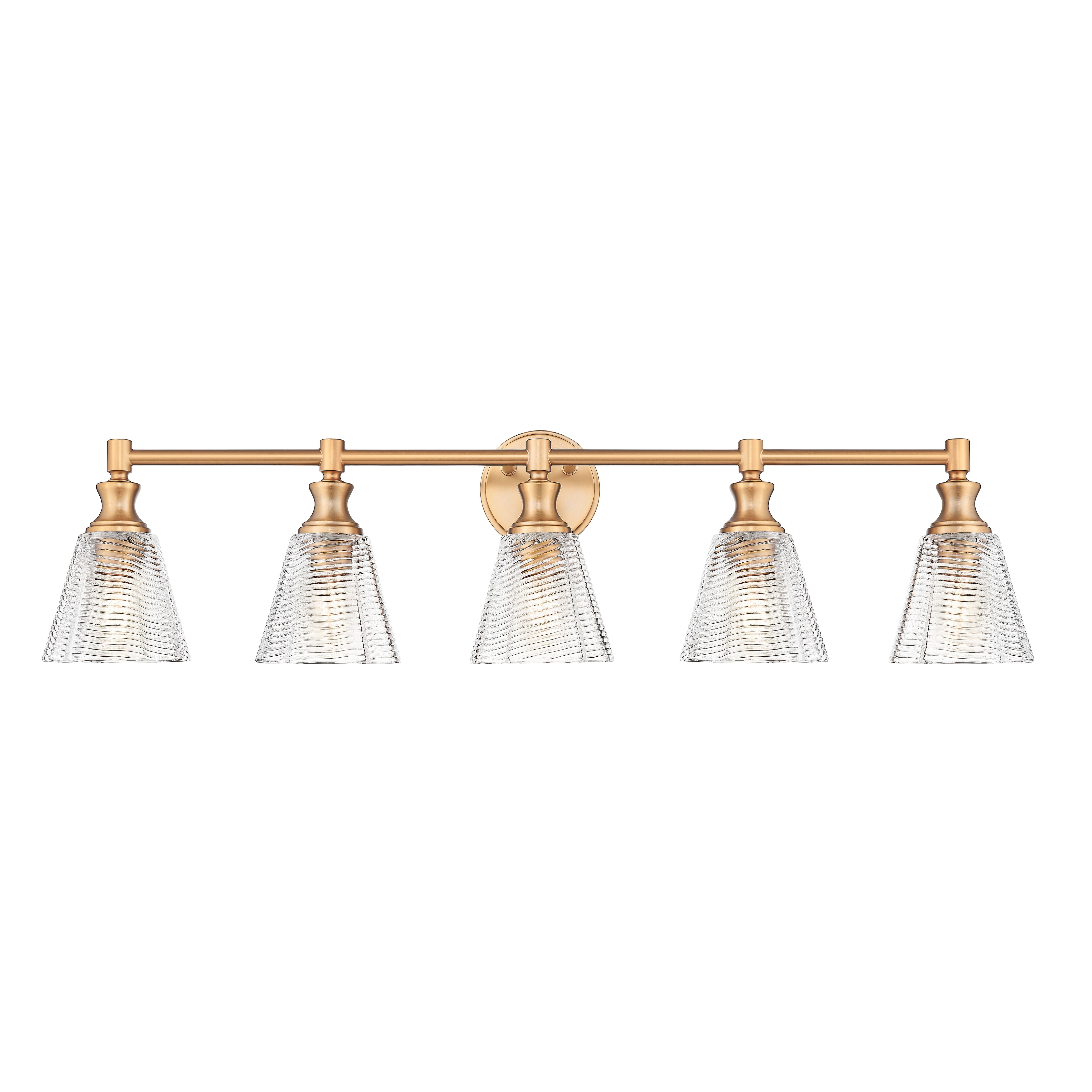 A five-light bathroom vanity light fixture with a warm brass horizontal bar and five clear ribbed glass shades, shown against a plain white background.