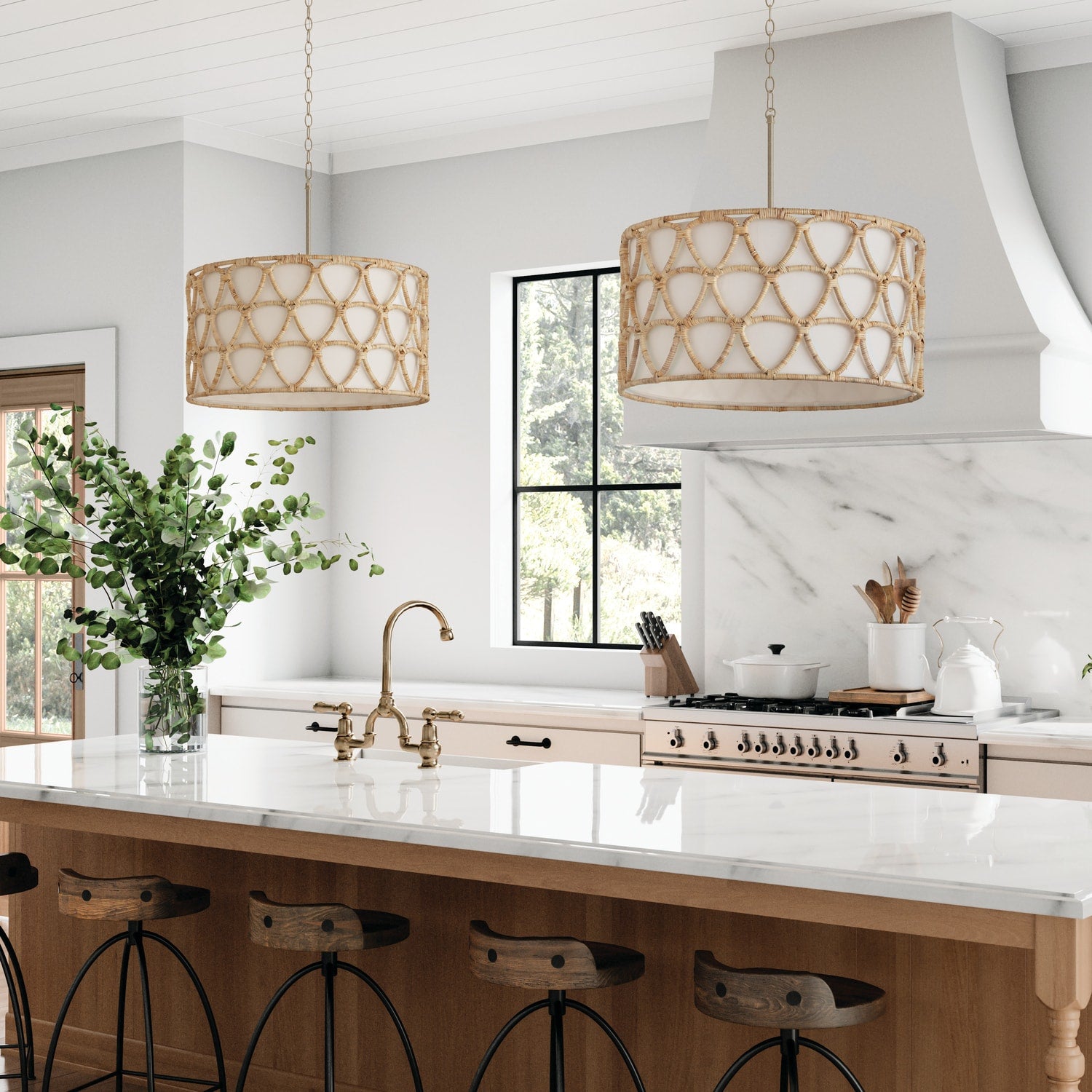 Modern kitchen with two woven ceiling lights over a marble island, featuring natural wood accents and brass fixtures, creating a warm, stylish ambiance.