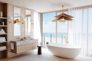 Luxury bathroom interior design with a spa-like retreat featuring a freestanding tub, floating vanity, gold fixtures, and a large window overlooking the ocean.