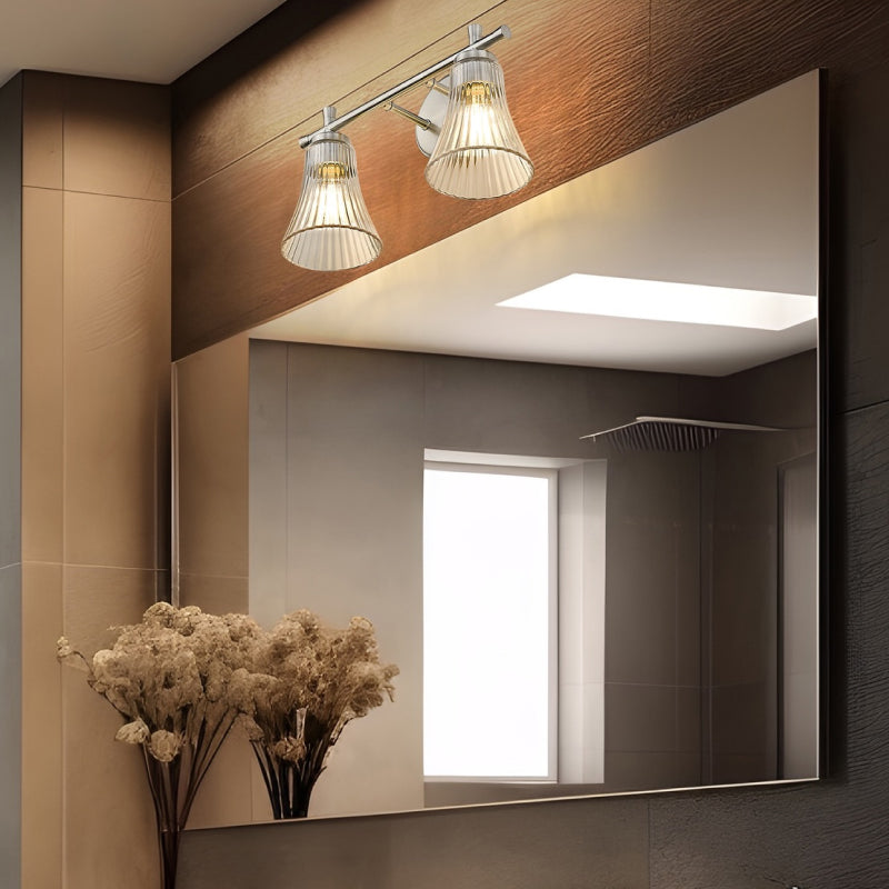 Chrome Vanity Lights 1 chrome vanity light with ribbed glass shades above a large bathroom mirror.