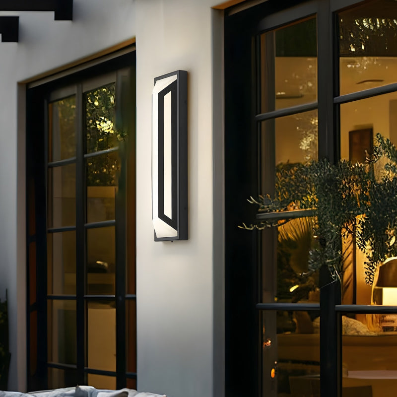 Modern Outdoor Wall Lights modern rectangular outdoor wall light mounted between black exterior windows.