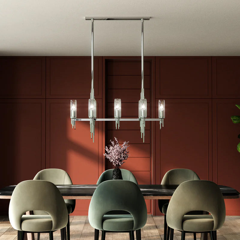 Linear Chandeliers chrome linear chandelier with glass shades above a modern dining table.