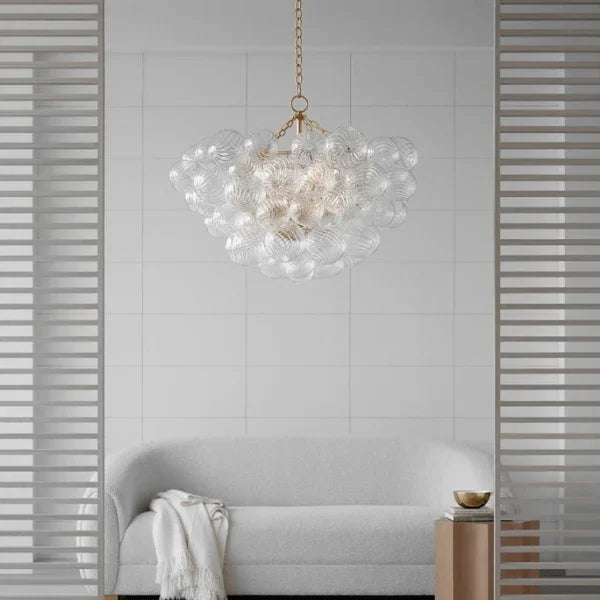 Visual Comfort Signature Collection chandelier with a cluster of glass globes in a minimalist living room, available at Lights Canada.