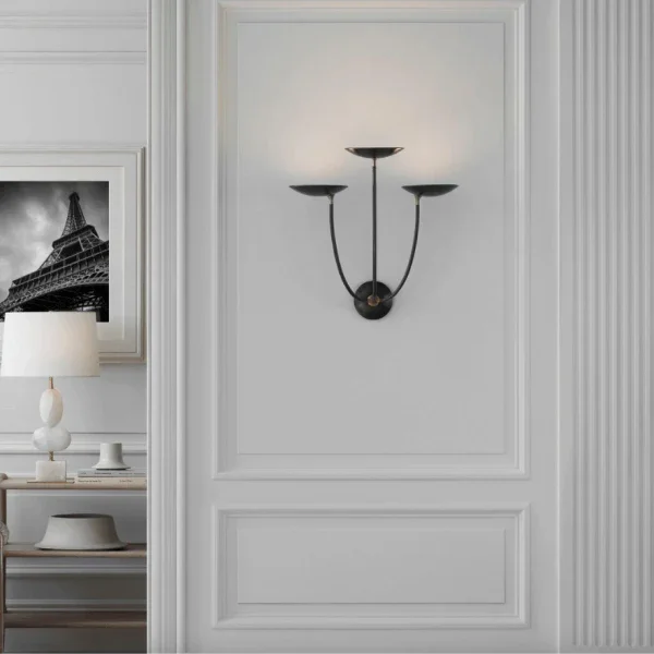 Elegant black wall sconce by Visual Comfort Signature Collection with a three-arm design in a classic interior.