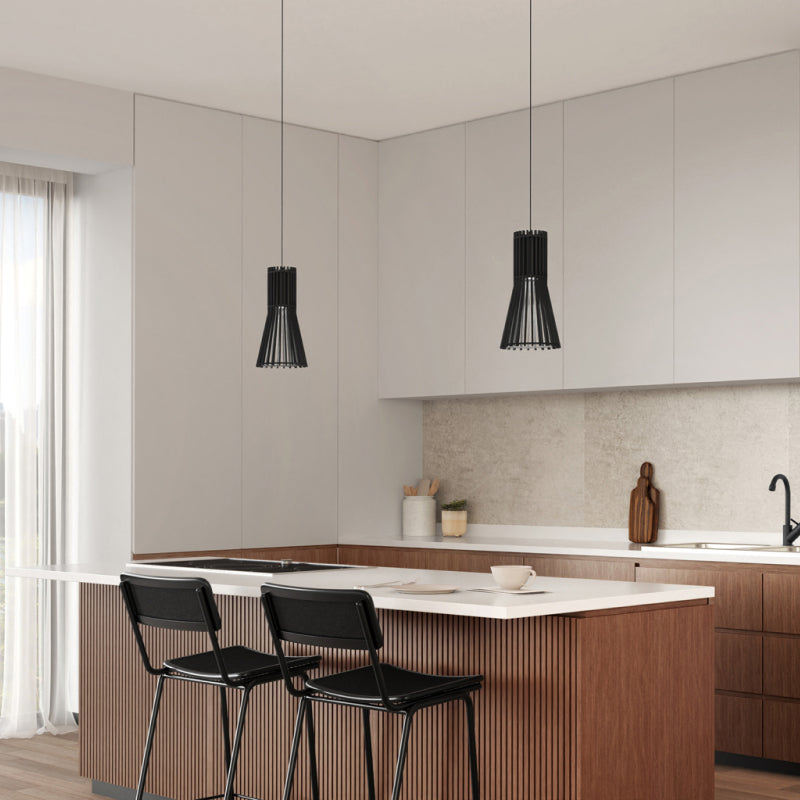 Mini Pendants black mini pendant lights above a modern kitchen island.
