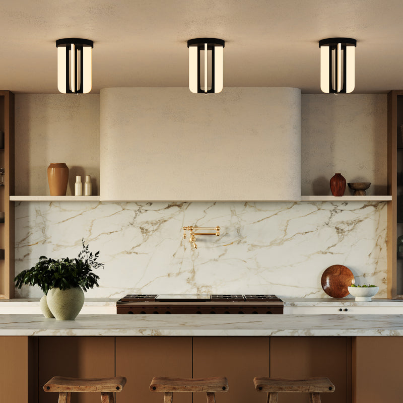 Semi Flush Mounts black and white semi flush mount lights above a modern kitchen with marble backsplash.