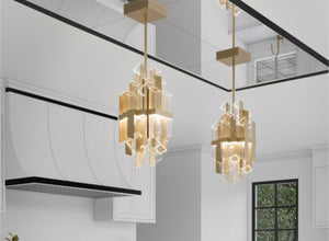 Art Deco chandelier featuring geometric design and gold accents, adding a touch of luxury to a modern kitchen interior.