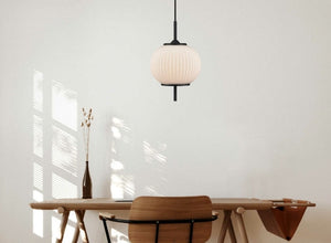 Japandi lighting with a minimalist pendant light and neutral decor, blending Japanese and Scandinavian design elements.