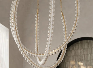 Dramatic Jewels chandelier with cascading glass beads and gold accents, adding elegance to any luxurious space.