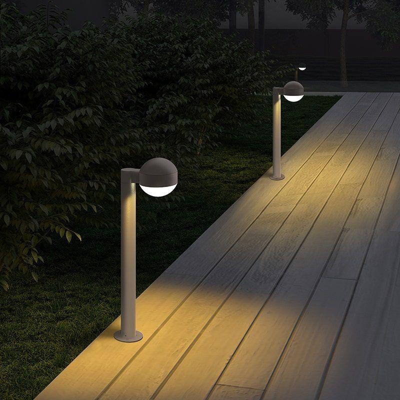 LED Landscape Lights modern LED path lights illuminating a wooden outdoor walkway.