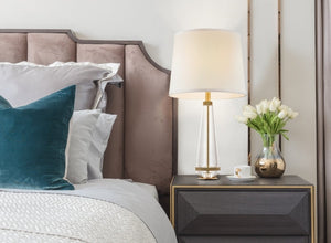 Classic & Traditional lighting with a gold and glass bedside lamp in a modern bedroom.