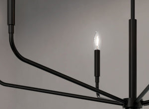 Bold black lighting showcasing a modern chandelier with sleek lines and elegant candle-style bulbs