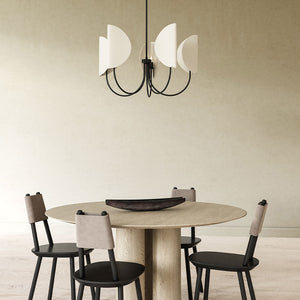 Modern chandelier with black frame and minimalist white shades hanging over a round dining table, available at Lights Canada.