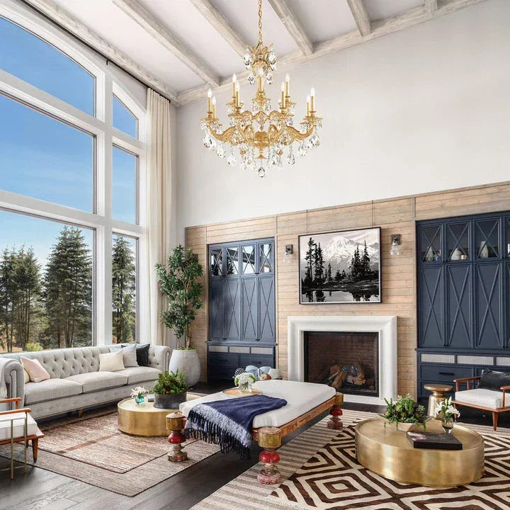 Schonbek crystal chandelier with gold detailing hanging in a luxurious living room with high ceilings and large windows, available at Lights Canada.
