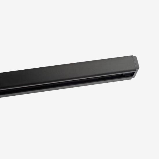 Black ceiling-mounted track rail for customizable directional lighting systems.