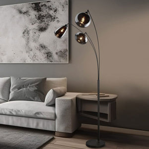 Modern floor lamp by Trio Lighting with three adjustable heads in a contemporary living room.