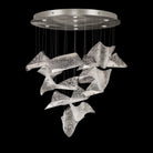 Chandelier with cascading curved textured clear glass panels and a round silver ceiling canopy.