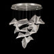 Chandelier with cascading curved textured clear glass panels and a round silver ceiling canopy.
