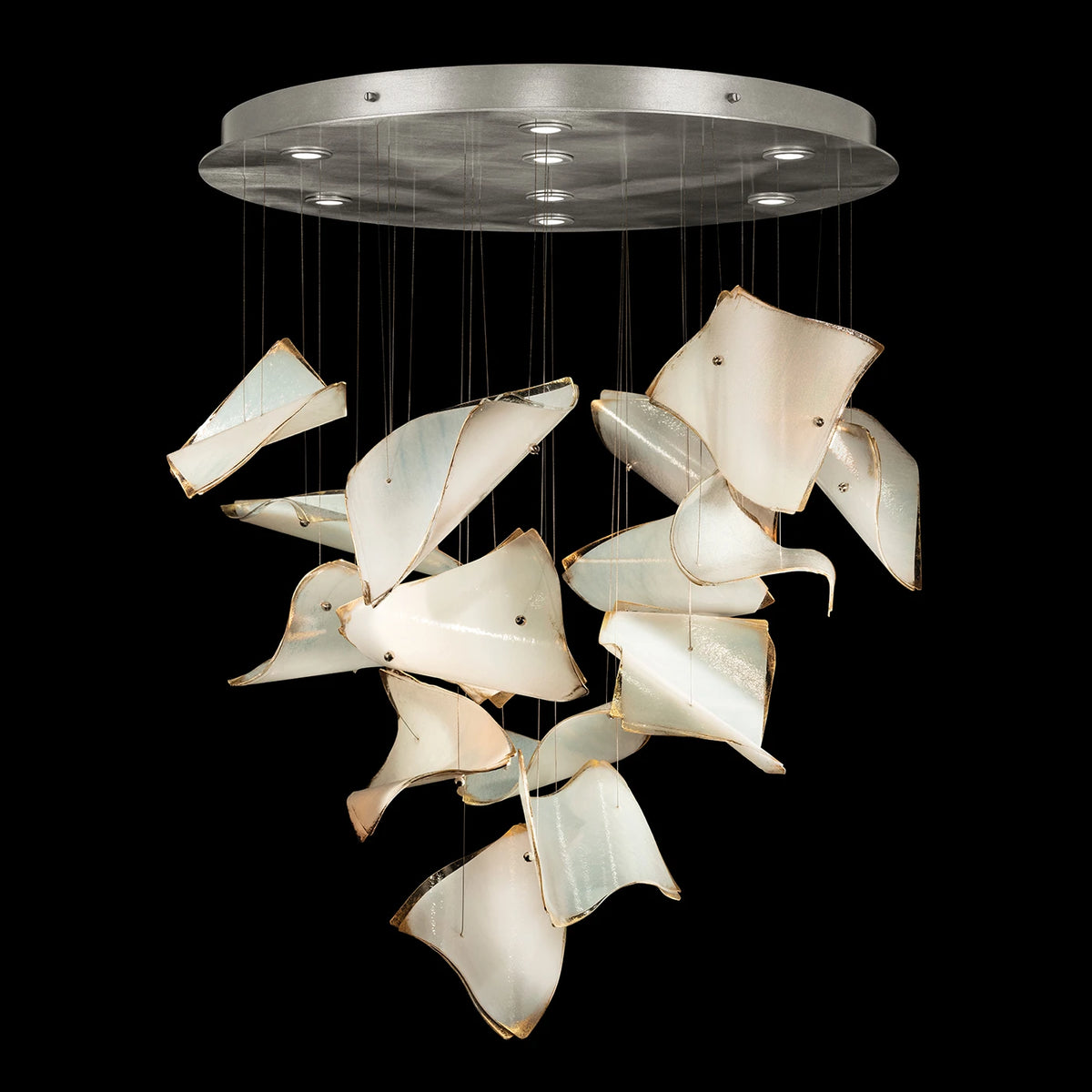 Chandelier with cascading curved ivory glass panels, gold-toned edges and a round silver ceiling canopy.