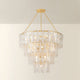 Tappan tiered crystal chandelier illuminated, with warm glow visible through layered rectangular glass panels on gold chain