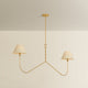 Two-arm chandelier with twisted gold brass stem and two curved arms each holding a cream drum shade