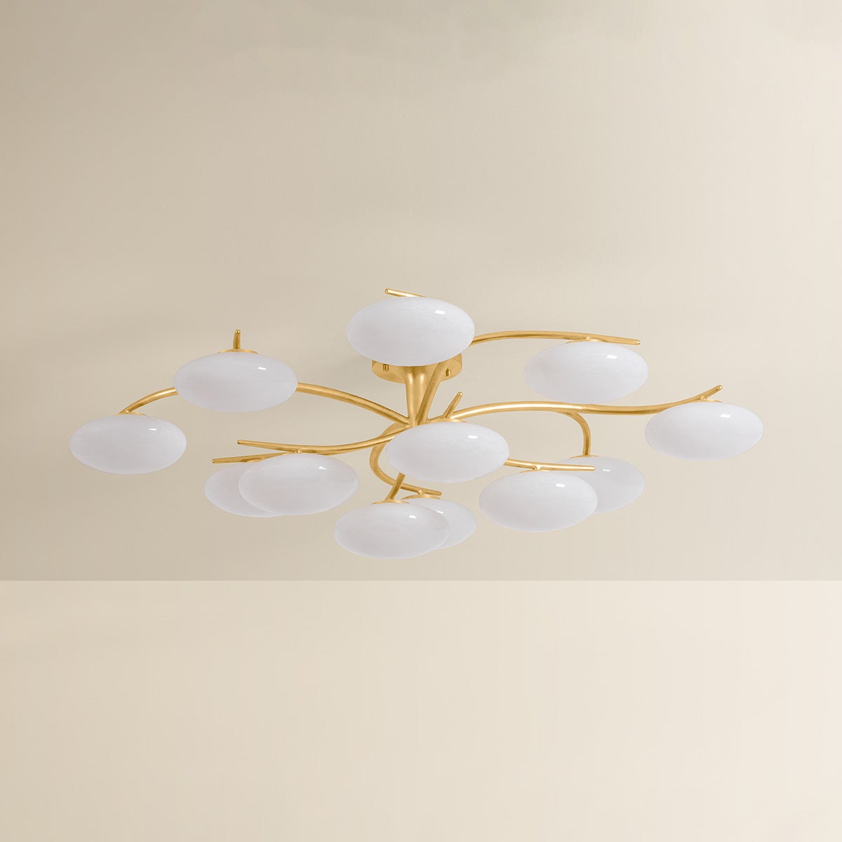 Bayberry multi-arm chandelier with unlit oval white glass globes on gold brass branches, product shot