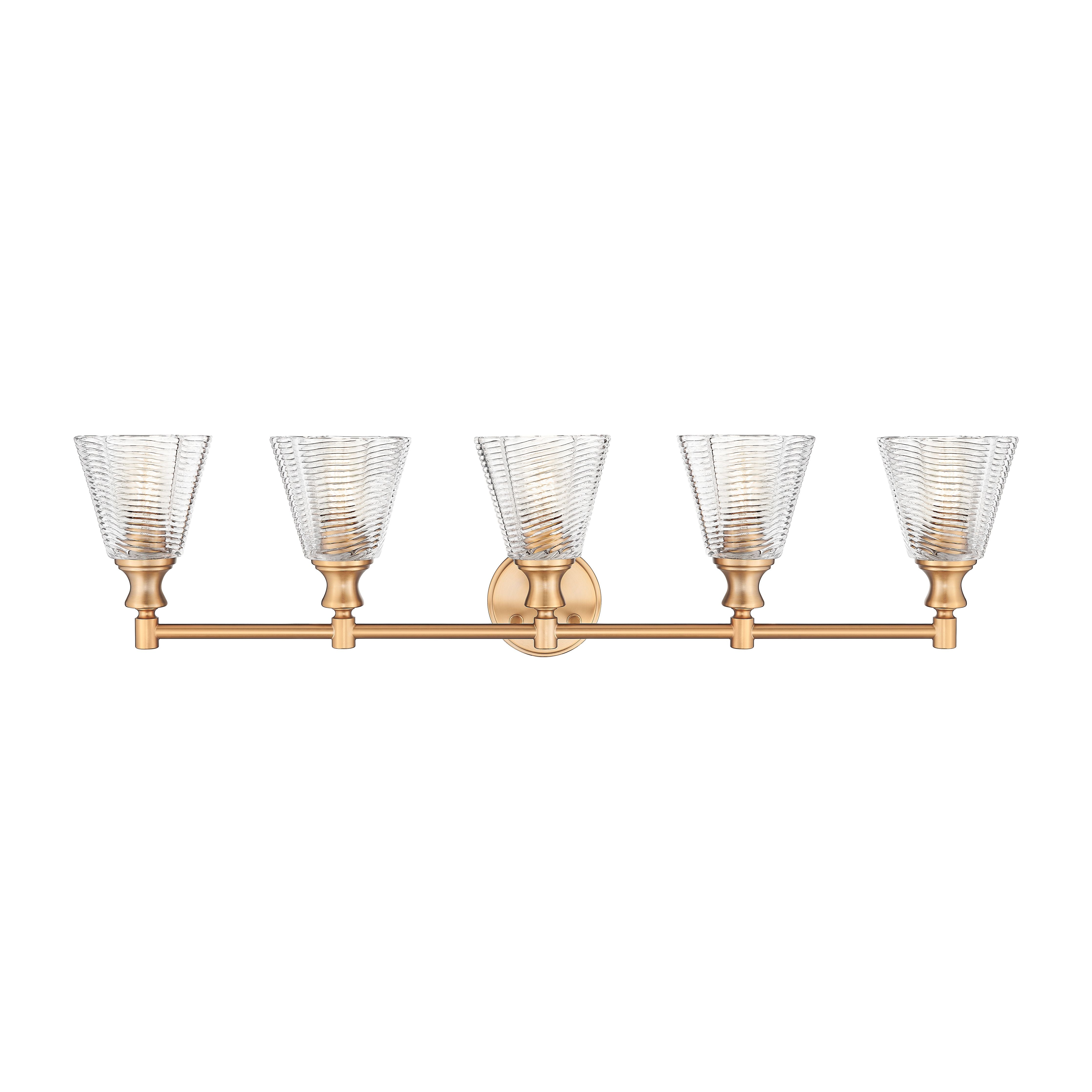 A five-light wall-mounted vanity light fixture with a brushed brass or gold-finished horizontal bar and five clear ribbed glass shades, shown against a plain white background.