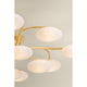 Close-up view from below of multi-arm chandelier with oval white glass globes on gold brass arms