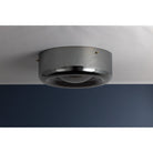 Gunmetal grey round flush mount ceiling light installed on ceiling in styled room