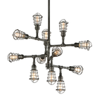 Industrial-style multi-arm chandelier with cage-covered Edison bulbs in aged pewter finish on a white background