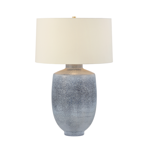 Table lamp with textured gray base and white shade on a white background