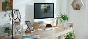 black geometric desk lamp with desk decor