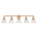 A five-light bathroom vanity light fixture with a warm brass horizontal bar and five clear ribbed glass shades, shown against a plain white background.
