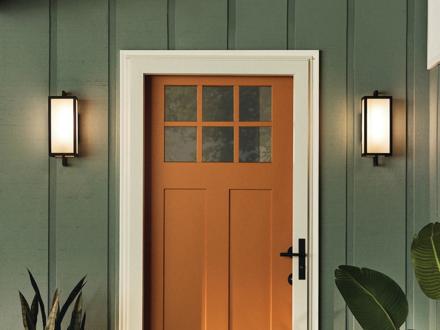 Pair of matte black rectangular outdoor wall sconces with frosted glass panels flanking terracotta craftsman front door on sage green board and batten exterior