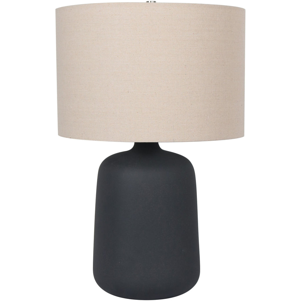 Norlan 24-inch table lamp with matte black rounded base and beige fabric drum shade.